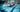 Asian woman swimming freestyle in a clean lap pool, mid-stroke side view.