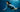 Asian freediver descending gracefully underwater in SAILBEE's diving rashguard.