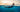 Split underwater/over-water view of ocean swimming, navy rashguard visible through the divide.