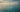 Ocean safety scene — calm tropical sea with a subtle rip-current pattern and a distant swimmer.