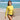 Model wearing the yellow long sleeve rash guard on a sunny beach