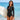 Model wearing the SAILBEE women’s UPF 50+ ruched rash guard on a sunny beach