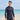 Model wearing the SAILBEE men’s UPF 50+ rash guard on a sunny beach