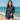 Model wearing the SAILBEE women UPF 50+ long-sleeve rash guard swim set on a sunny beach